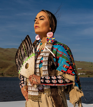 Stacia Morfin, Chief Executive Officer of Nez Perce Tourism and Citizen of the Nimiipuu Nation wearing Nez Perce traditional regalia.