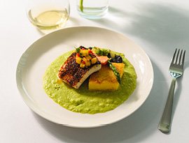 Blackened Florida Grouper, with Caramelized Polenta Cake, Cilantro Lime Grits, and topped with Mango Pico de Gallo and Champagne Butter Sauce served on American Cruise Lines.