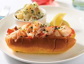 A plate of Native New England Lobster, Drawn Cabot Farms Butter, Potato & Chive Salad served on American Cruise Lines.